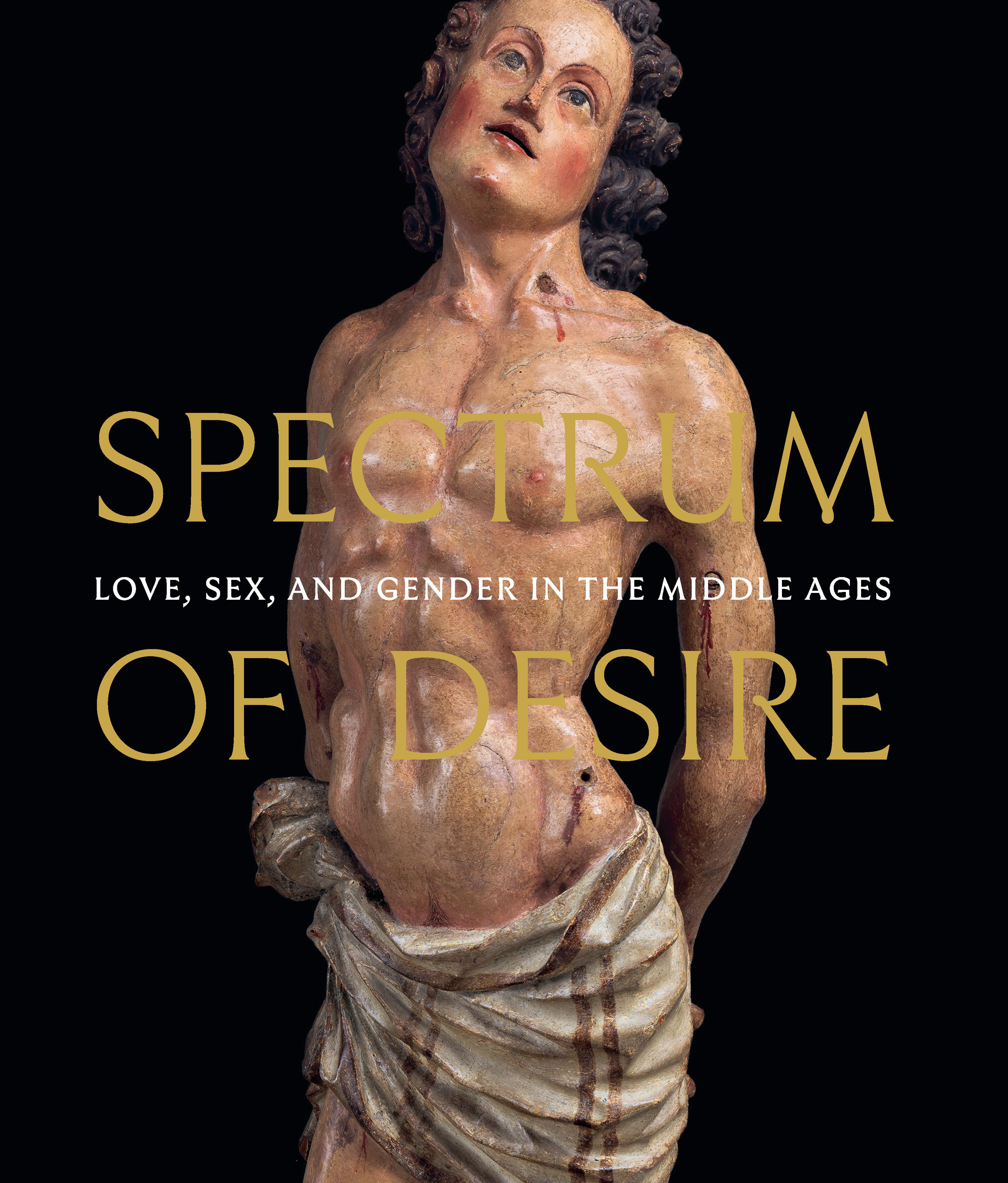 a painted wood sculpture of a human figure with a bare torso and bloody arrow wounds